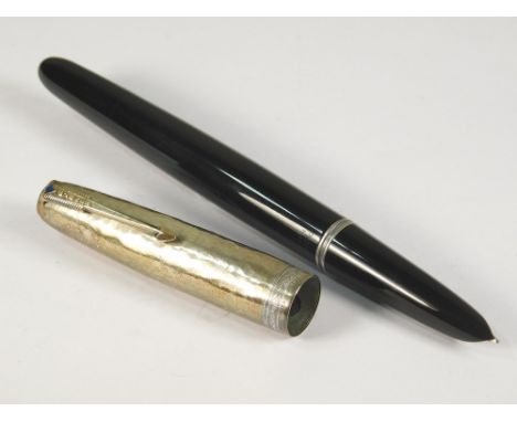 PARKER. A Parker 51 fountain pen. Hooded italic nib. Black celluloid pen with plastic button filler &amp; hammered sterling s