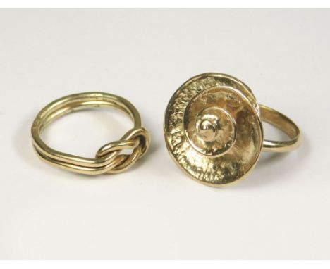 GOLD RINGS. Two 9ct. gold dress rings hand made by John (Red) Simpson, St. Ives. Ammonite ring size M. Knot ring size K/L.