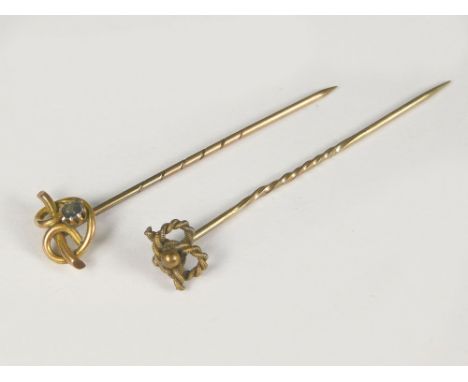 STICK PINS. A Victorian 15ct. gold knot stick pin &amp; a 9ct. gold stone set stick pin.