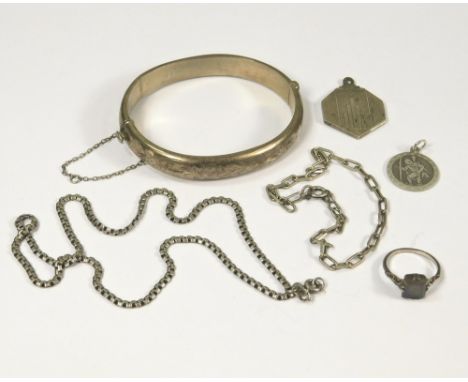 SILVER. Silver jewellery including a St. Christopher pendant, an engine turned silver locket, a hinged silver bangle etc.
