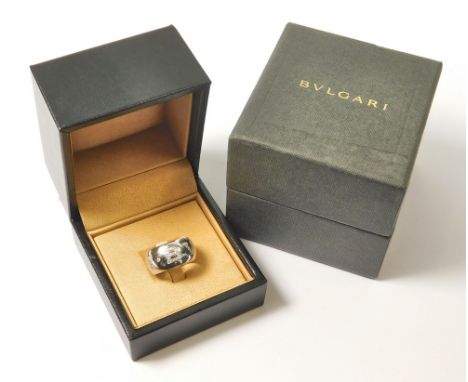 BVLGARI. A Bvlgari 18ct. white gold diamond set Monologo ring. Fully stamped. Size K/L. Approx. 13.1g. Original box &amp; out