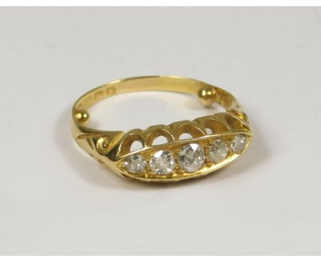 DIAMOND RING. An 18ct. gold five stone diamond ring. Birmingham 1910. Size J.