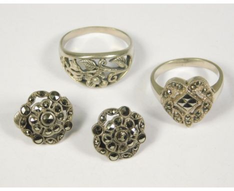 SILVER & MARCASITE. A silver & marcasite heart shaped ring, a pair of silver & marcasite ear clips & a silver ring in Art Nou