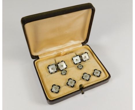 DRESS SET. A dress set comprising cufflinks & studs, set with mother of pearl, black enamel & marcasite.