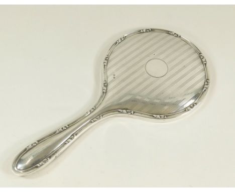 HAND MIRROR. An engine turned silver hand mirror. Birmingham 1946. Length 29cm.