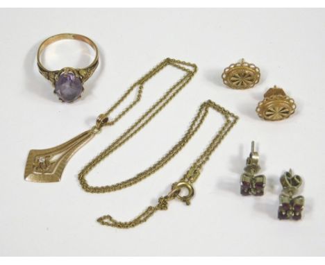 GOLD PENDANT ETC. A 10k. small pendant on rolled gold chain, a yellow metal amethyst dress ring, a pair of yellow metal stud 