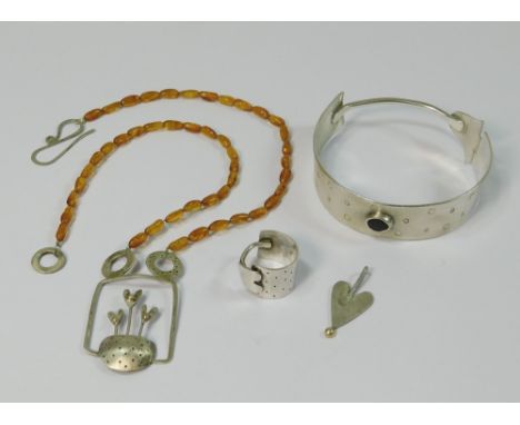 AMBER ETC. A designer amber bead & silver necklace, a silver & gold heart shaped pendant drop & a hammered silver bangle with