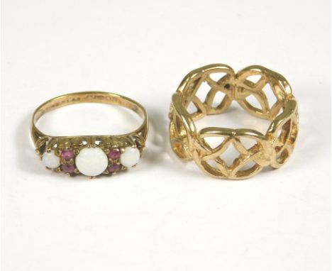 GOLD RINGS. A 9ct. gold opal &amp; ruby dress ring, size M &amp; a 9ct. gold ring in Celtic style. Total weight approx. 6.2g.