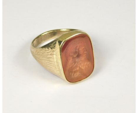 SEAL RING. A gentleman's 9ct. gold seal ring set an intaglio carnelian of a male classical head. Hand made by John (Red) Simp