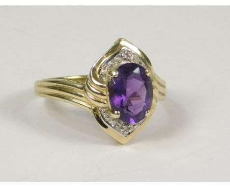 AMETHYST RING. A 9ct. gold amethyst set dress ring. Size N.