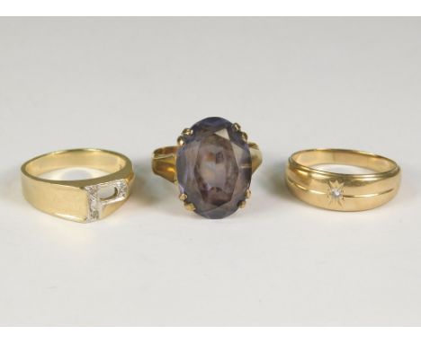 DRESS RINGS. A 10k. initial 'P' ring, a 14k. diamond set ring &amp; a yellow metal dress ring.