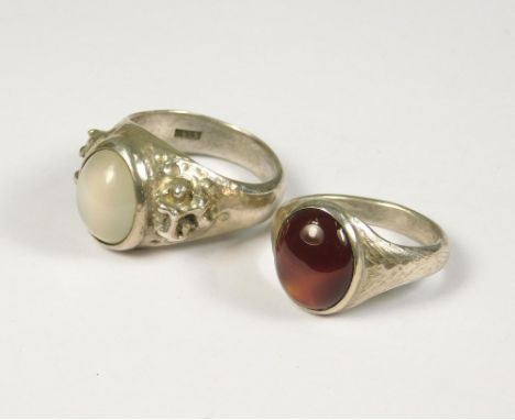 SILVER RINGS. A silver &amp; grey agate dress ring by John (Red) Simpson, St. Ives. Size P/Q. Also, a silver &amp; carnelian 