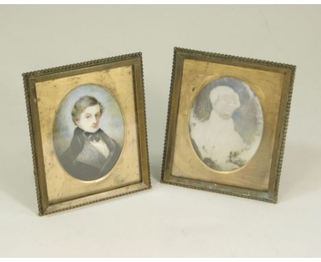 PHOTOGRAPH FRAMES. Two 19th century brass photograph frames, one with a hand painted portrait miniature, unsigned, of a gentl
