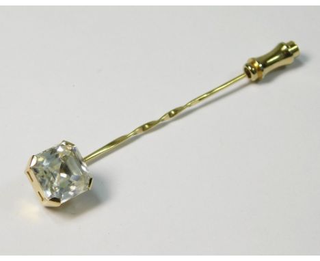 STICK PIN. An 18ct. gold stick pin, set a large emerald cut colourless zircon.