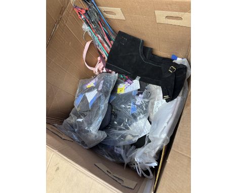 Twenty riding whips; burgundy full size headcollar; set of red pony size bandages; one black full size bridle; white small br