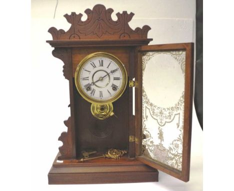 American 8 day striking cottage clock in a timber case, key and pendulum included