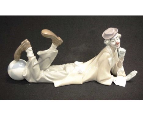 Lladro rerecumbent clown ceramic figure resting clown figure, marked to base, (height 17cm; length 37cm approx).