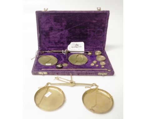 Two gold measure balance scales comprising of 19th century (20cm wide) and a later cased set (29cm x 16cm)