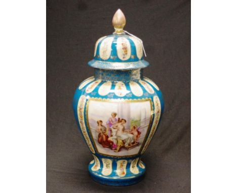 German painted lidded ceramic vase painted blossom decoration in cartouches, on blue ground, with gilt highlights, to lid and