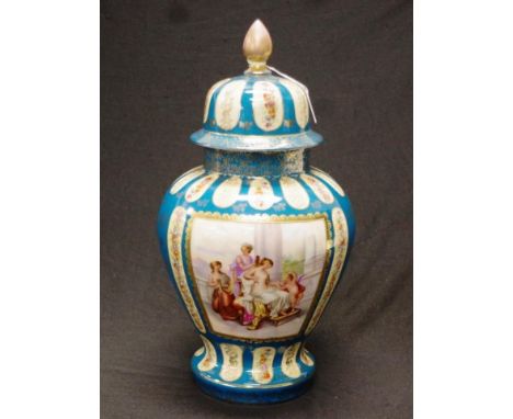 German painted lidded ceramic vase painted blossom decoration in cartouches, on blue ground, with gilt highlights, to lid and