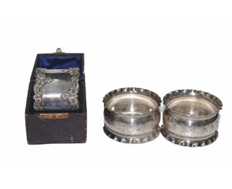 Three sterling silver napkin rings including: monogrammed napkin ring, in original fitted presentation case; and pair Edward 