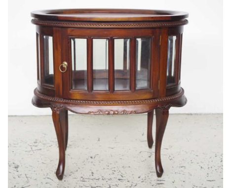 Mahogany tray topped drinks cabinet with separate oval shaped serving tray to top, of bevelled glass cased cabinet, door open