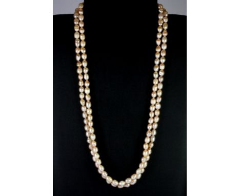 Two peach coloured fresh water pearl necklaces, L. 30cm.