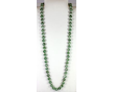 A jade/hardstone bead necklace, L. 80cm.