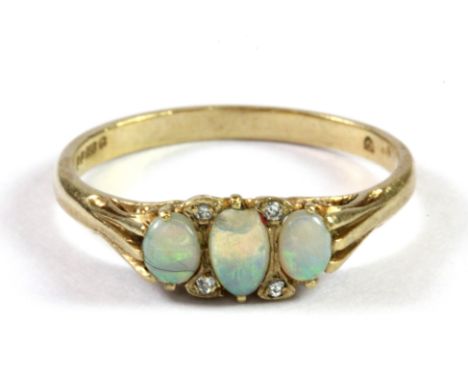 A lovely antique 9ct yellow gold ring set with opals and diamonds in an antique box, (N.5) (one opal a/f).