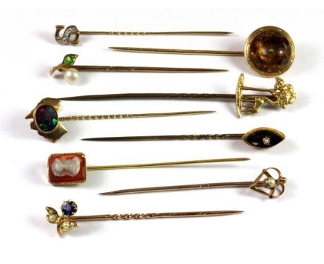 A quantity of mixed gold stone set stick pins.