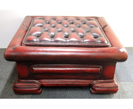 A button backed ox blood leather coffee table/stool, 73 x 73 x 35cm.