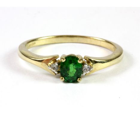 A 9ct yellow gold tzavorite and white topaz set ring (R.5).