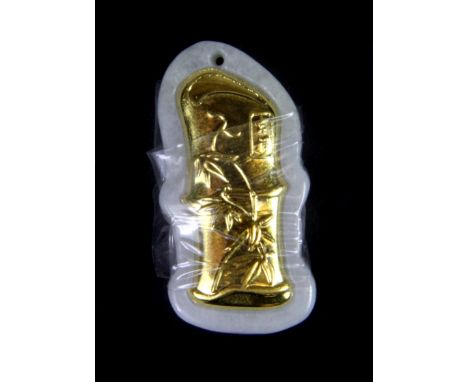 A fine Chinese carved jade and yellow metal (tested 22ct gold) pendant in the form of a stem of bamboo. H. 3.2cms.
