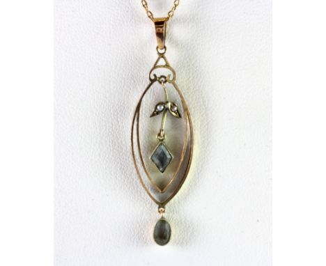 An Edwardian 9ct yellow gold aquamarine and seed pearl set pendant and chain.