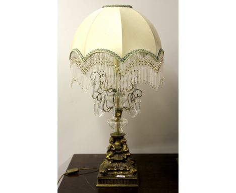 An impressive gilt brass and crystal table lamp with beaded shade, H. 83cm.