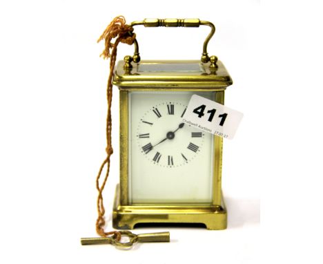 A brass carriage clock. H. 14cms.