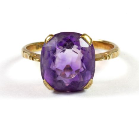 A yellow metal (tested minimum 9ct gold) amethyst set ring (P.5).
