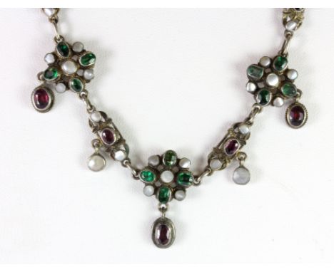 An early 19th century Austro-Hungarian filigree silver necklace set with almondine garnets, tsavorites and mother of pearl.