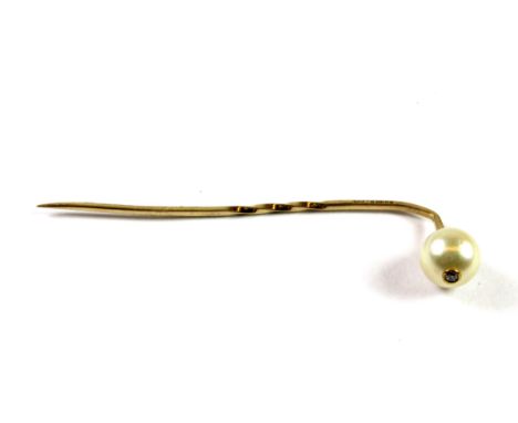 A 9ct yellow gold pearl and diamond set stick pin.