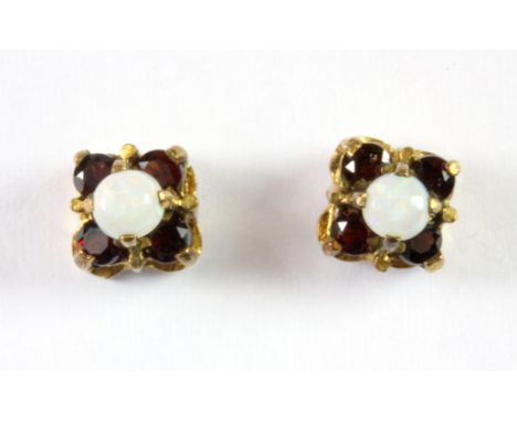 A pair of 9ct yellow gold opal and garnet stud earrings.