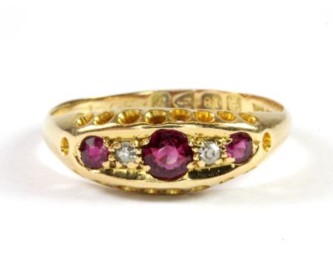 An antique 18ct yellow gold ruby and diamond set ring (L.5).
