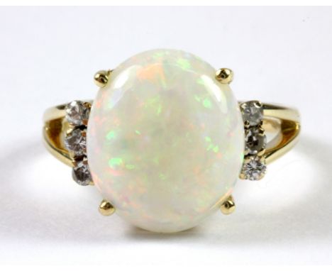 An 18ct yellow gold opal and diamond set ring (N.5).