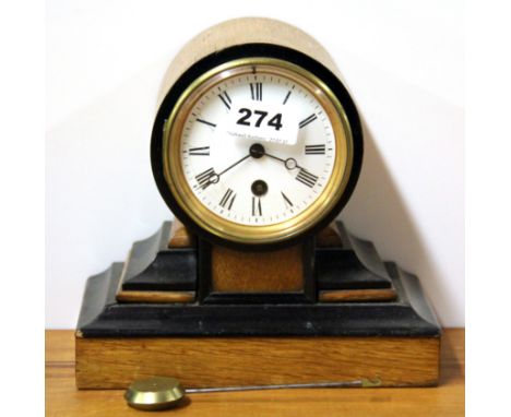A small Edwardian mahogany ebonised mantle clock. H. 19cms.
