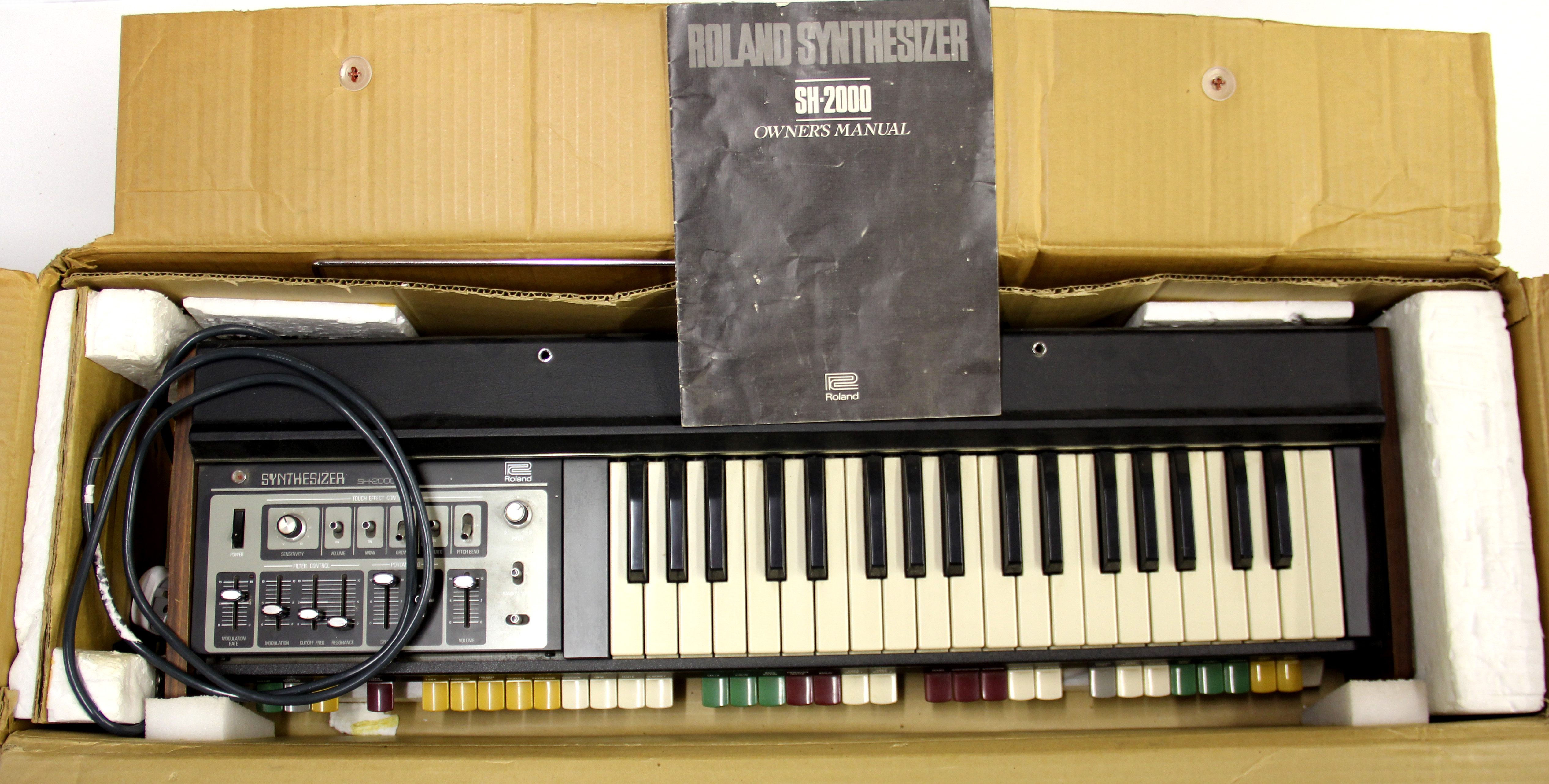 A vintage Roland SH2000 synthesizer.