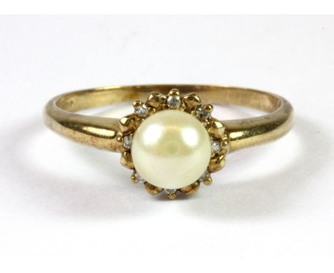 A 9ct yellow gold pearl and diamond set ring (V.5).