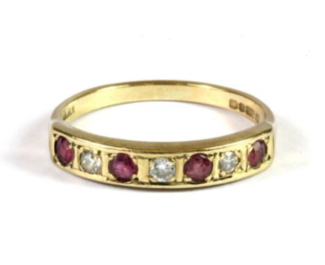 A 9ct yellow gold ruby and diamond half eternity (L).
