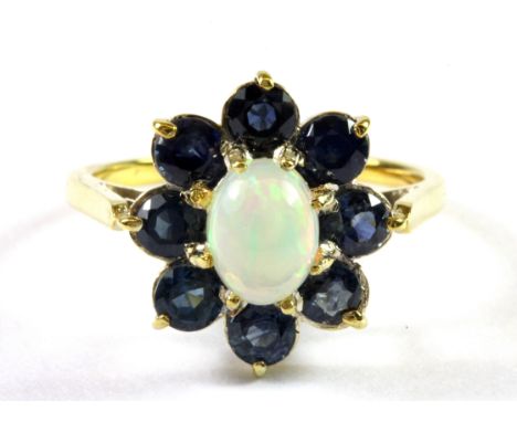 A yellow metal (tested minimum 9ct gold) sapphire and opal cluster ring (S.5).