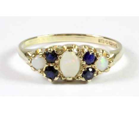 A pretty 9ct yellow gold opal and sapphire set ring (M.5).