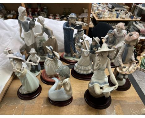 A Collection of Nao porcelain figures including a clown, an artist, dancing figures, musicians, mermaid, children etc 