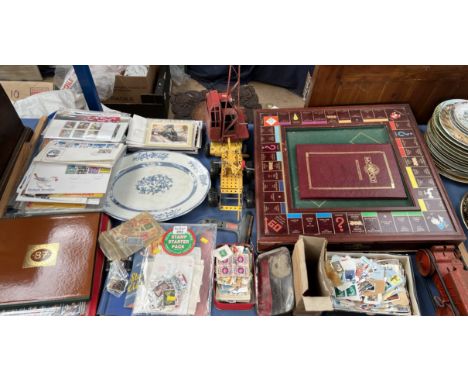 A collectors edition Monopoly board together with tin plate toys, and a large collection of stamps and first day covers etc  